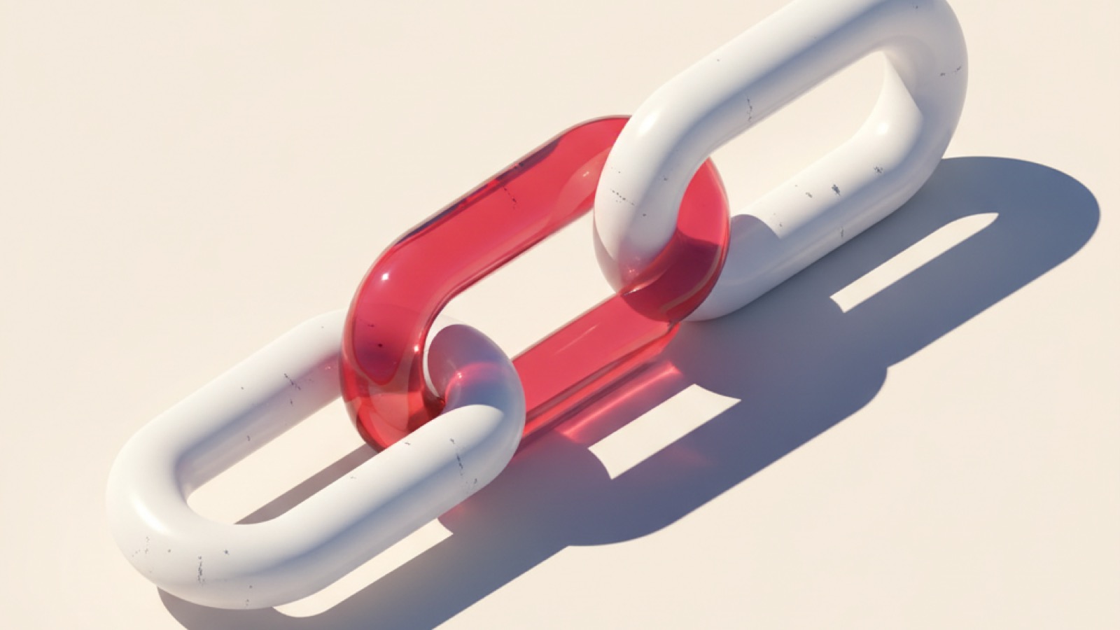 Two chain links — one white, one red — locked firmly together, a symbol of unity and solidarity
